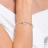 Brazalete Hyperbola con el símbolo Infinity y un corazón, blanco, acabado en metales mixtos