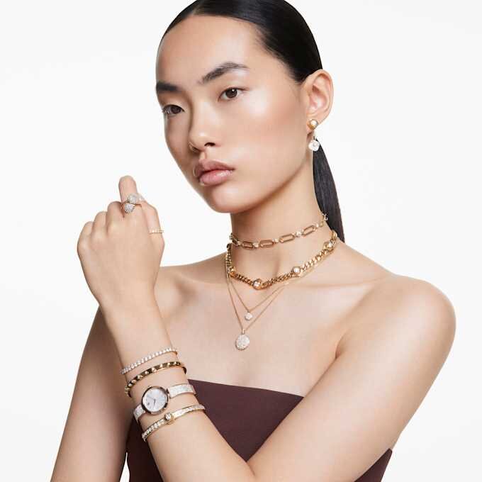 Brazalete Numina de corte redondo, blanco, chapado en tono dorado Brazalete Numina de corte redondo, blanco, chapado en tono dorado