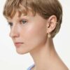 Pendientes colgantes Idyllia con ear cuff de cortes variados, corazón con llave, rosa, chapados en tono dorado Pendientes colgantes Idyllia con ear cuff de cortes variados, corazón con llave, rosa, chapados en tono dorado
