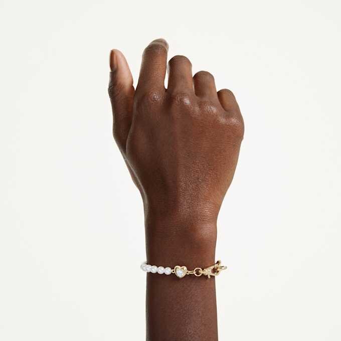 Pulseras Idyllia con perlas de cristal, blancas, chapadas en tono dorado Pulseras Idyllia con perlas de cristal, blancas, chapadas en tono dorado