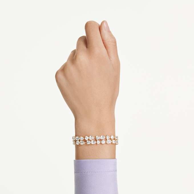 Pulseras Mesmera con cortes variados, blancas, chapadas en tono dorado Pulseras Mesmera con cortes variados, blancas, chapadas en tono dorado