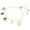 Pulseras Symbolica con perla de cristal, trébol, ojo del mal y herradura, azul, chapada en tono dorado Pulseras Symbolica con perla de cristal, trébol, ojo del mal y herradura, azul, chapada en tono dorado